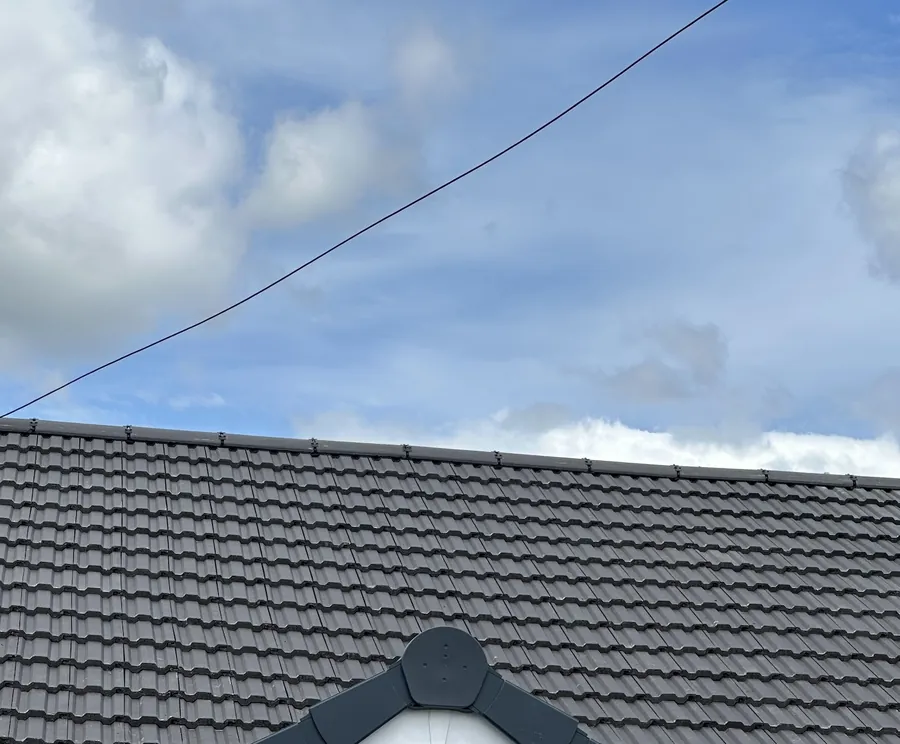 Newly tiled roof gable with ridge vent, Basildon